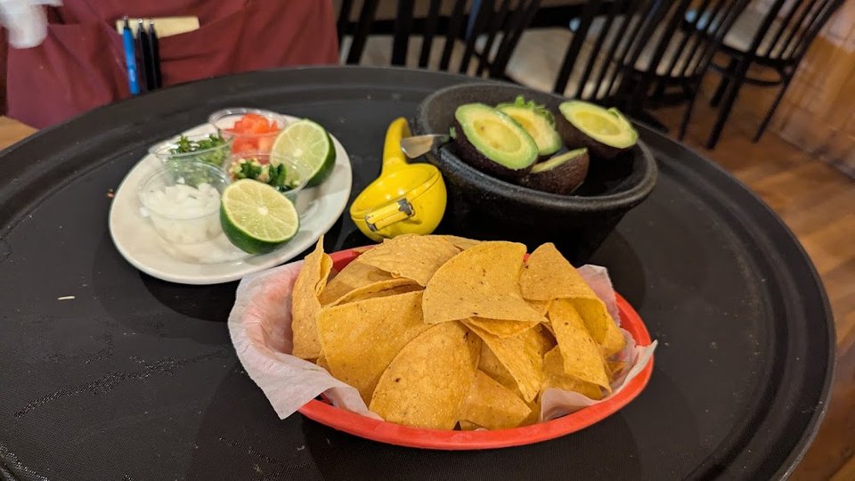 Printed menu showing wraps, paninis, and drinks.